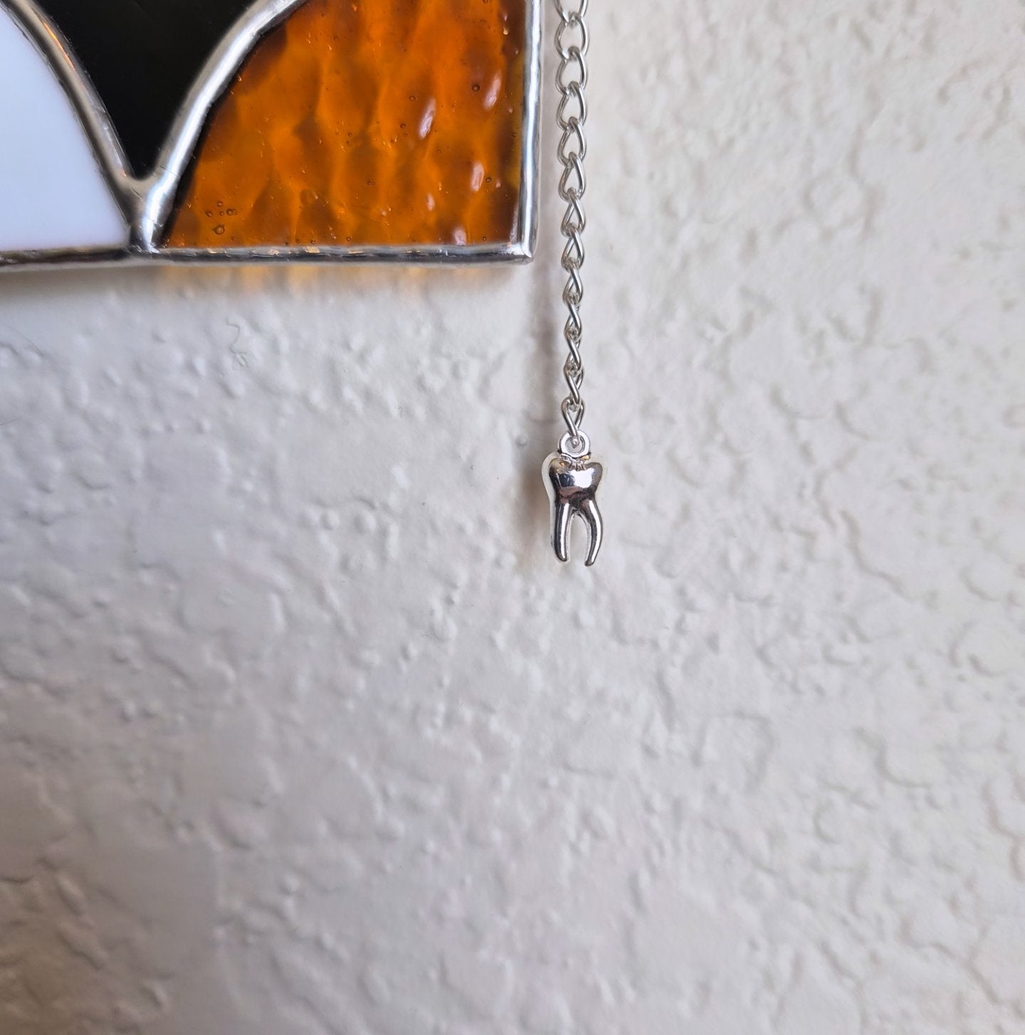 Star hanger with tooth charm